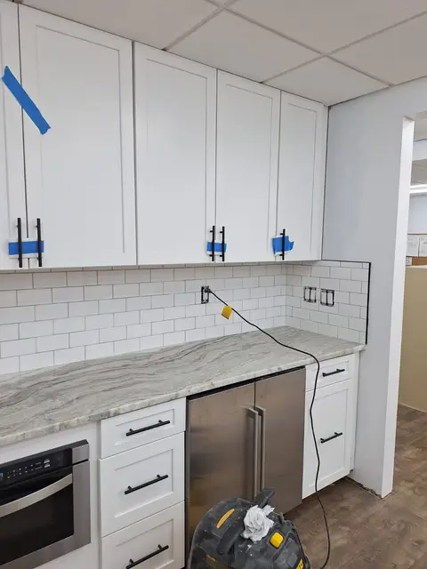 Kitchen with white subway tile backsplash and granite countertop, Kings Mountain Tile project in North Carolina